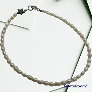 Freshwater pearl string bracelet with star‎ detailing B0512